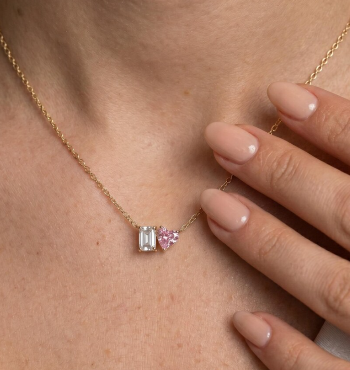 Close-up of pink heart-cut and emerald-cut diamonds on Toi et Moi Necklace