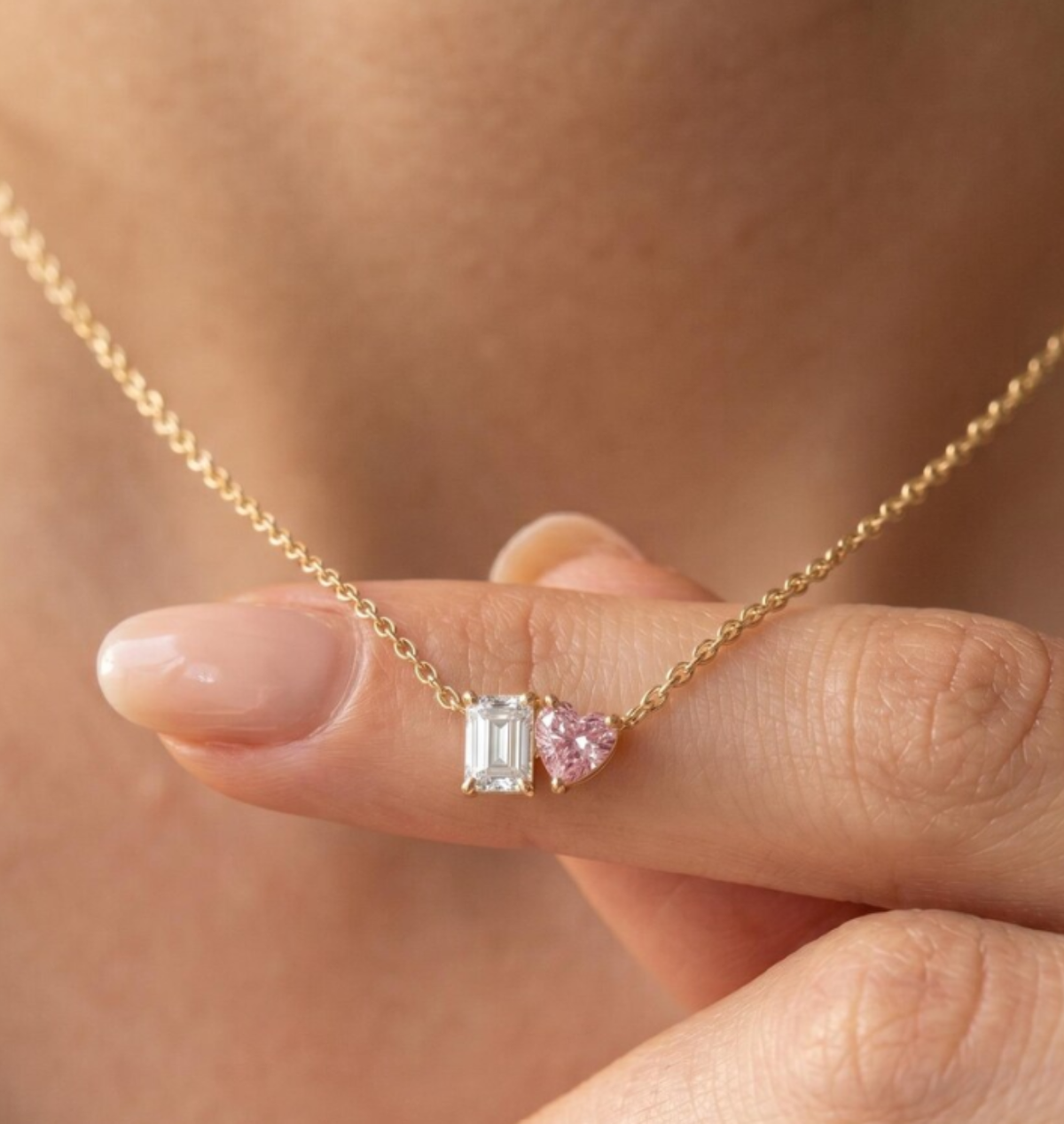 Pink heart-cut diamond paired with emerald-cut diamond on Toi et Moi Necklace