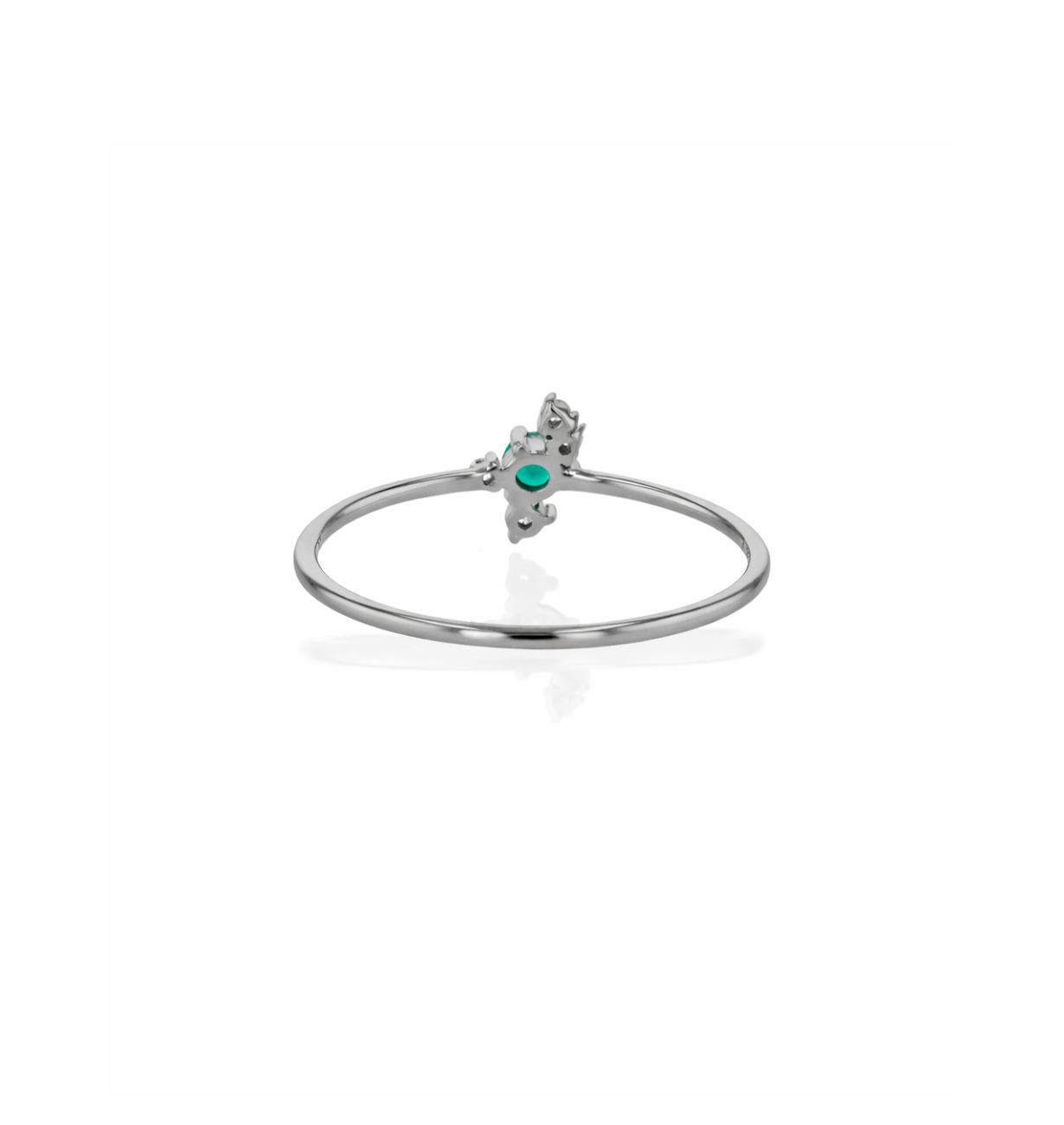 angled view of emerald lab grown diamond ring with petal style setting