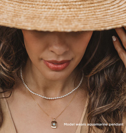 Elegant rectangular pendant with ruby center