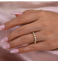 Gold full eternity ring with brilliant round stones