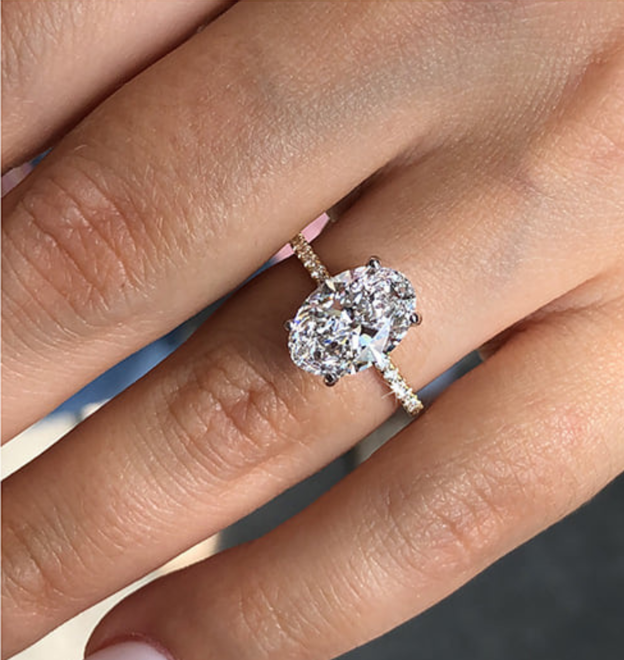 ale oval diamond ring with hidden halo and gold band