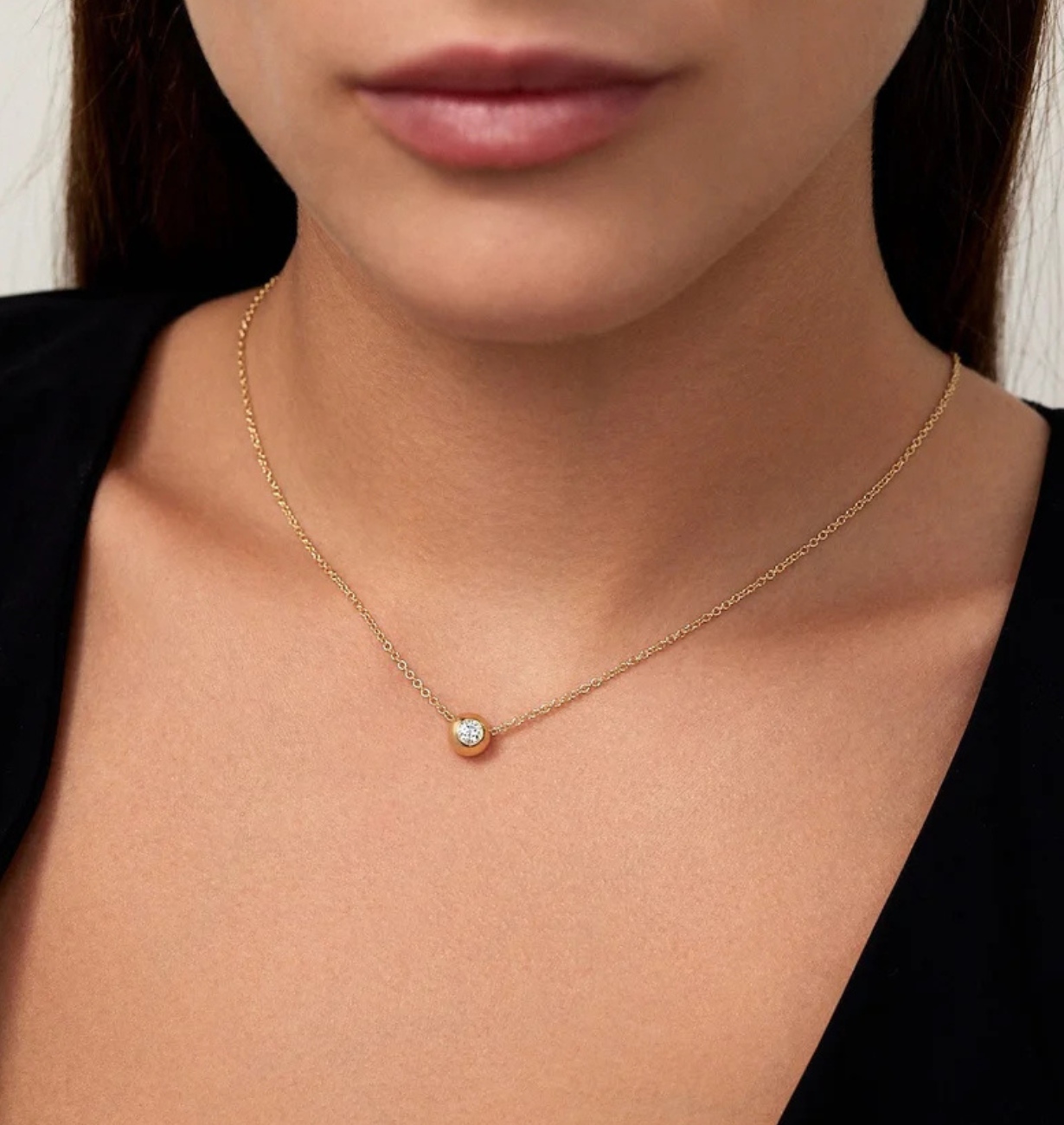 round lab grown diamond necklace with halo design in 14k gold