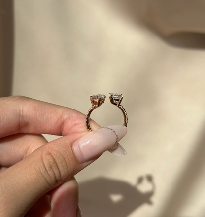 side view of pear and radiant diamond open cuff ring in 14k gold