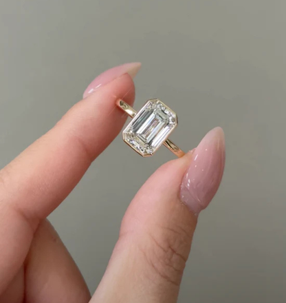 top view of emerald cut lab grown diamond engagement ring in gold
