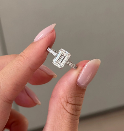 top view of emerald cut lab grown diamond engagement ring with pave band