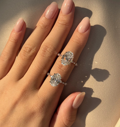 top view of oval lab grown diamond engagement ring hidden halo setting