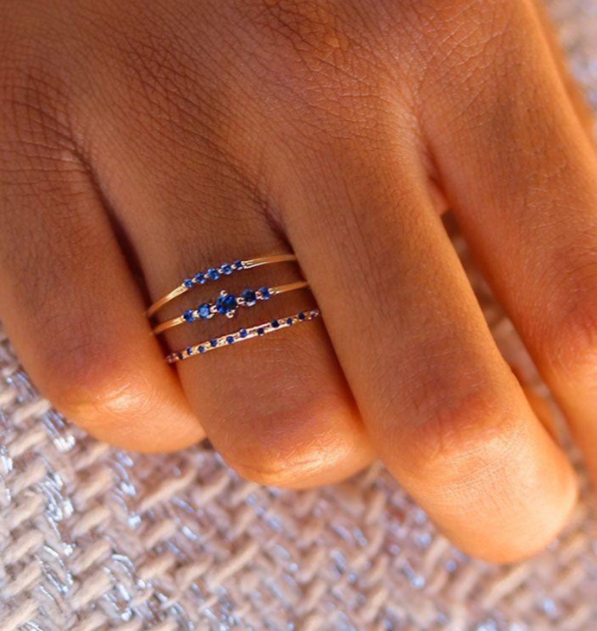 top view of starry sapphire ring with thin gold band